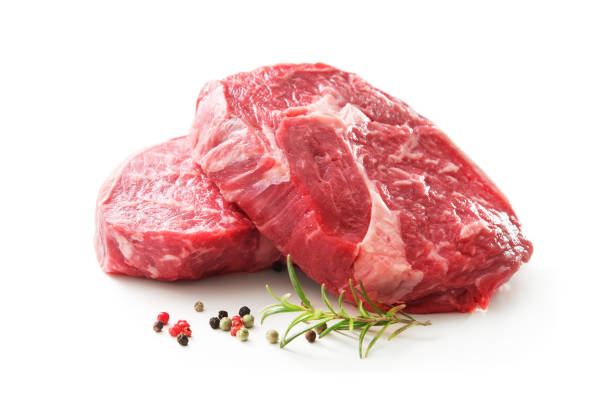 fresh raw rib eye steaks isolated on white background